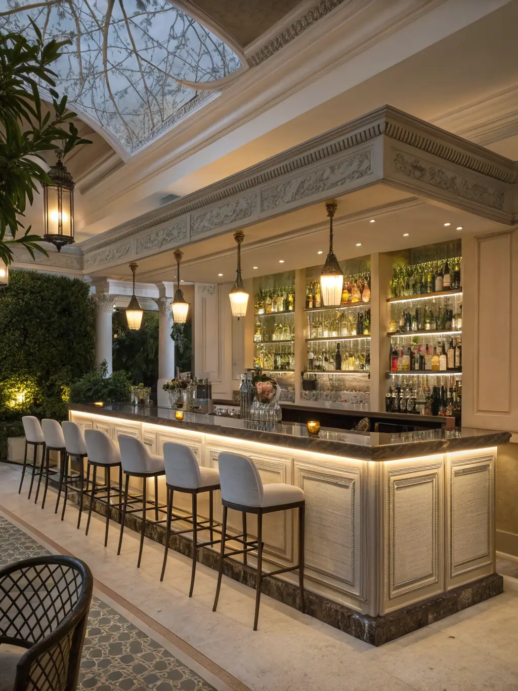 A luxurious home bar area with custom cabinetry, a granite countertop, and elegant lighting, demonstrating Renaissance Kitchens' ability to create sophisticated entertainment spaces.